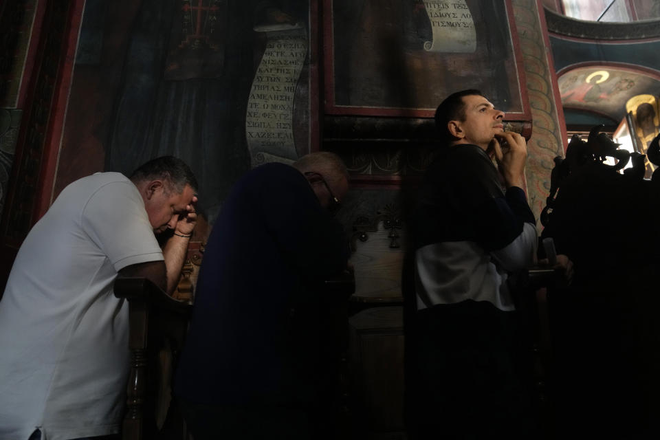 Male visitors attend the afternoon prayers at the Pantokrator Monastery in the Mount Athos, northern Greece, on Thursday, Oct. 13, 2022. The monastic community was first granted self-governance through a decree by Byzantine Emperor Basil II, in 883 AD. Throughout its history, women have been forbidden from entering, a ban that still stands. This rule is called "avaton" and the researchers believe that it concerns every form of disturbance that could affect Mt. Athos. (AP Photo/Thanassis Stavrakis)