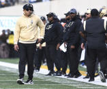 Purdue head coach Ryan Walters walks back to the bench during the first half of an NCAA college football game against Iowa, Saturday, Oct. 7, 2023, in Iowa City, Iowa. (AP Photo/Cliff Jette)