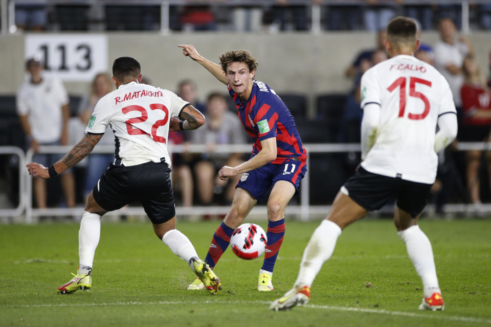 United States' Brenden Aaronson, center, passes the ball between Costa Rica's Ronald Matarrita, left, and Francisco Calvo during the first half of a World Cup qualifying soccer match Wednesday, Oct. 13, 2021, in Columbus, Ohio. (AP Photo/Jay LaPrete)