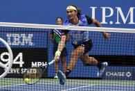 Lloyd Harris, of South Africa, returns a shot to Alexander Zverev, of Germany, during the quarterfinals of the US Open tennis championships, Wednesday, Sept. 8, 2021, in New York. (AP Photo/Elise Amendola)