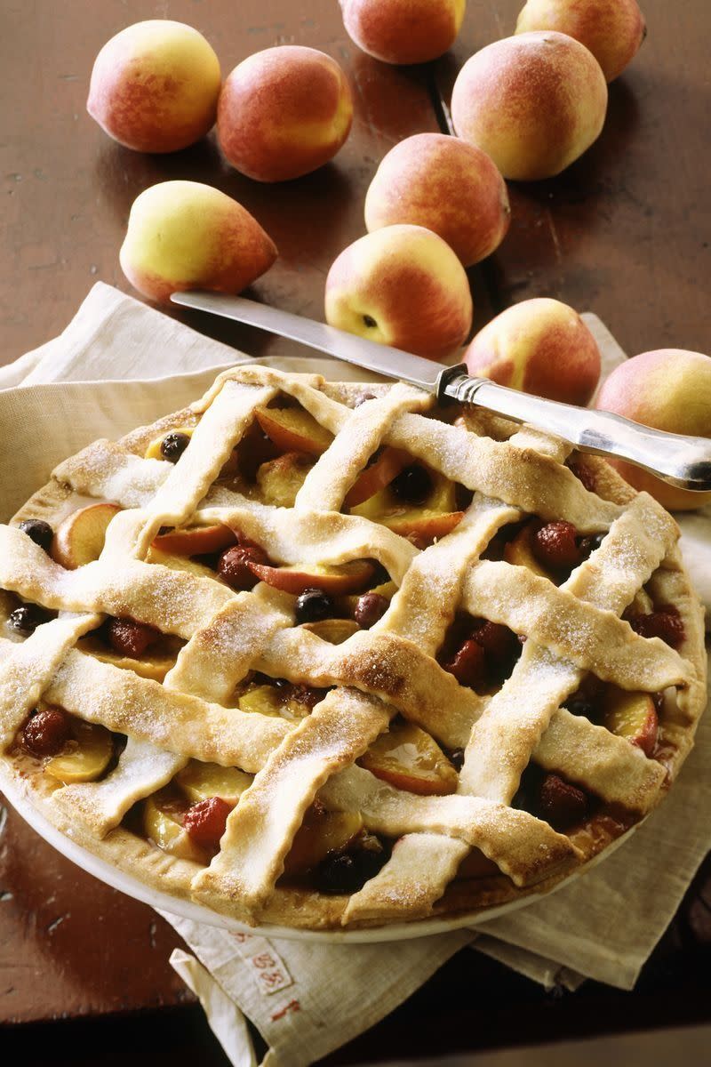 deep dish peach and berry pie with a lattice crust