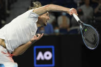 Alexander Zverev of Germany serves to John Millman of Australia during their second round match at the Australian Open tennis championships in Melbourne, Australia, Wednesday, Jan. 19, 2022. (AP Photo/Andy Brownbill)