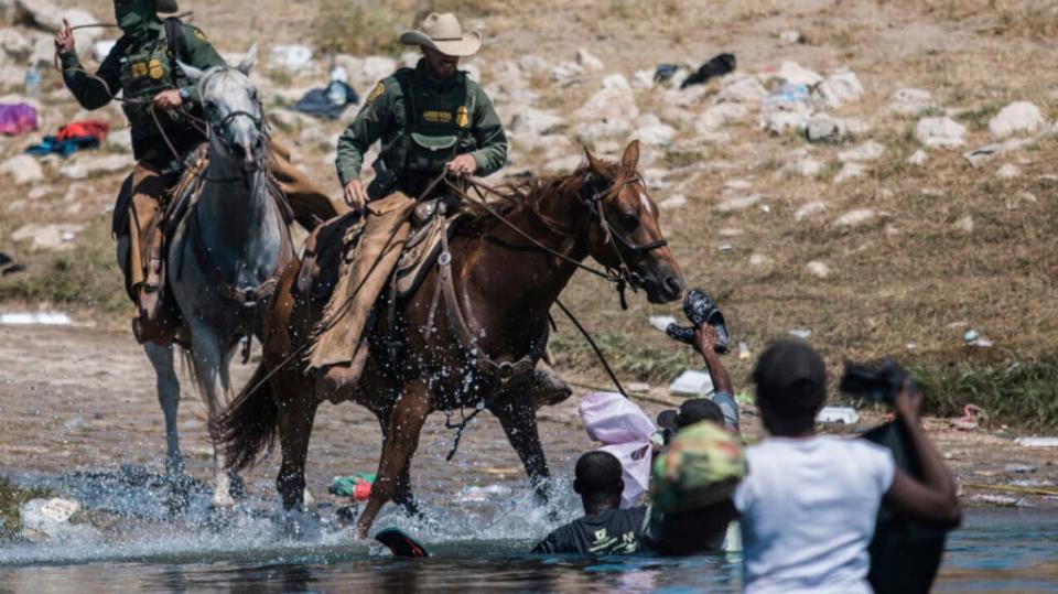 US Border Patrol on horse with Haitian migrants, theGrio.com