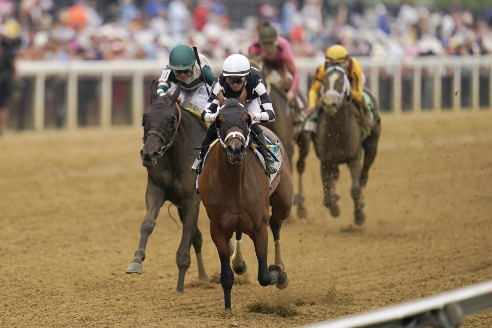 RETRANSMISSION TO CORRECT SURNAME - Florent Geroux, center, atop Interstatedaydream wins the 98th running of the Black-Eyed Susan at Pimlico Race Course, Friday, May 20, 2022, in Baltimore. (AP Photo/Julio Cortez)