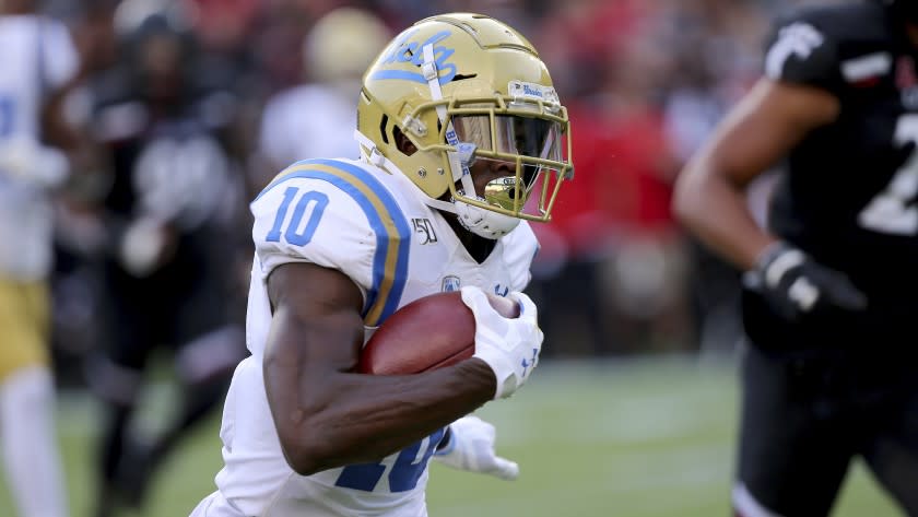 UCLA running back Demetric Felton during an NCAA football game on Thursday, Aug. 29, 2019 in Cincinnati. (AP Photo/Tony Tribble)