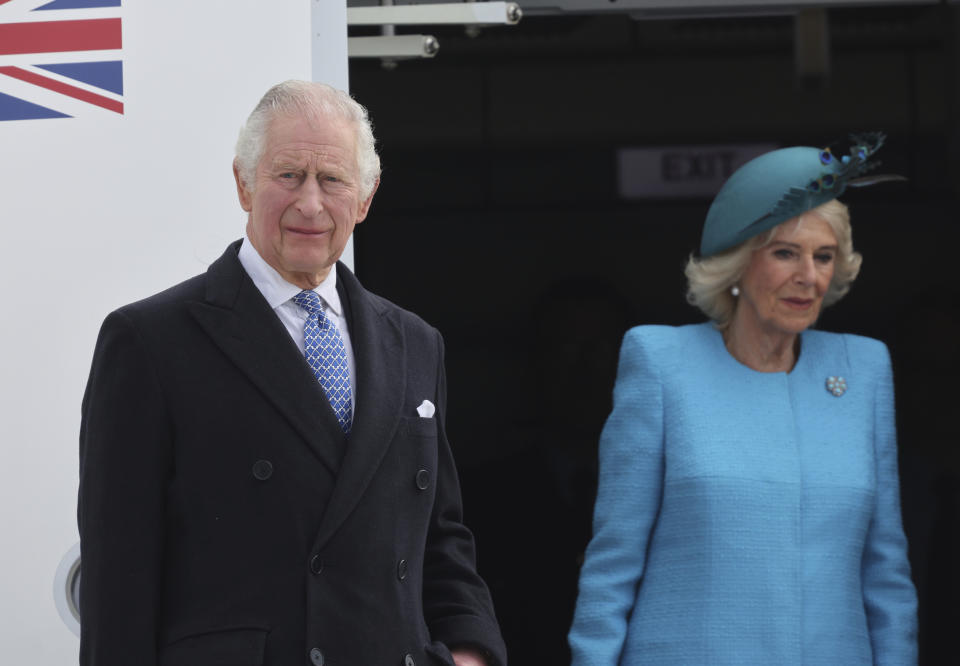 Britain's King Charles III and Camilla, the Queen Consort, arrive at the airport in Berlin, Wednesday, March 29, 2023. King Charles III arrives Wednesday for a three-day official visit to Germany. (Jens Buettner/dpa via AP)