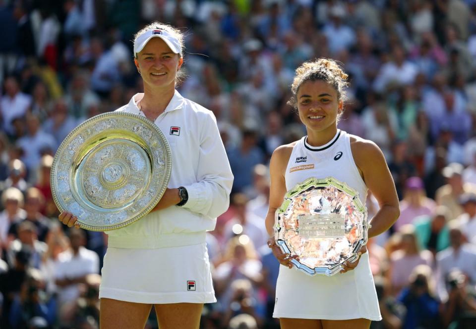 Krejcikova poses with the Venus Rosewater Dish trophy after winning the final against Jasmine Paolini (Reuters)