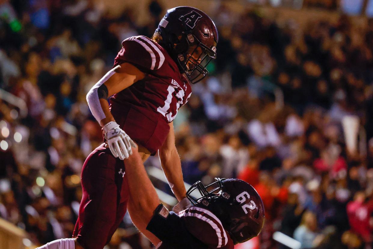 Abernathy’s Jaxson Hoel (13) celebrates a touchdown with lineman Cole Vadygriff (62) during a District 4-3A, Division II game Friday, Oct. 15, 2021 against Idalou at Antelope Field in Abernathy, Texas.