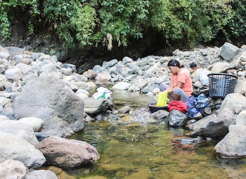 <span class="caption">Most of the world washes their clothing by hand.</span> <span class="attribution"><a class="link " href="https://pixabay.com/photos/woman-washing-river-female-water-3447847/" rel="nofollow noopener" target="_blank" data-ylk="slk:elJad/Pixabay;elm:context_link;itc:0;sec:content-canvas">elJad/Pixabay</a>, <a class="link " href="http://creativecommons.org/licenses/by-nc-sa/4.0/" rel="nofollow noopener" target="_blank" data-ylk="slk:CC BY-NC-SA;elm:context_link;itc:0;sec:content-canvas">CC BY-NC-SA</a></span>