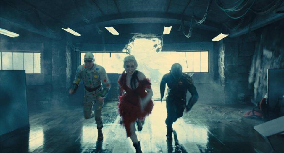 Margot Robbie, who played villain Harley Quinn in the first “Suicide Squad” and “Birds of Prey,” reprises her role in the new “The Suicide Squad,” joined by newcomers to the franchise David Dastmalchian, left, as Polka-Dot Man and Idris Elba as Bloodsport.