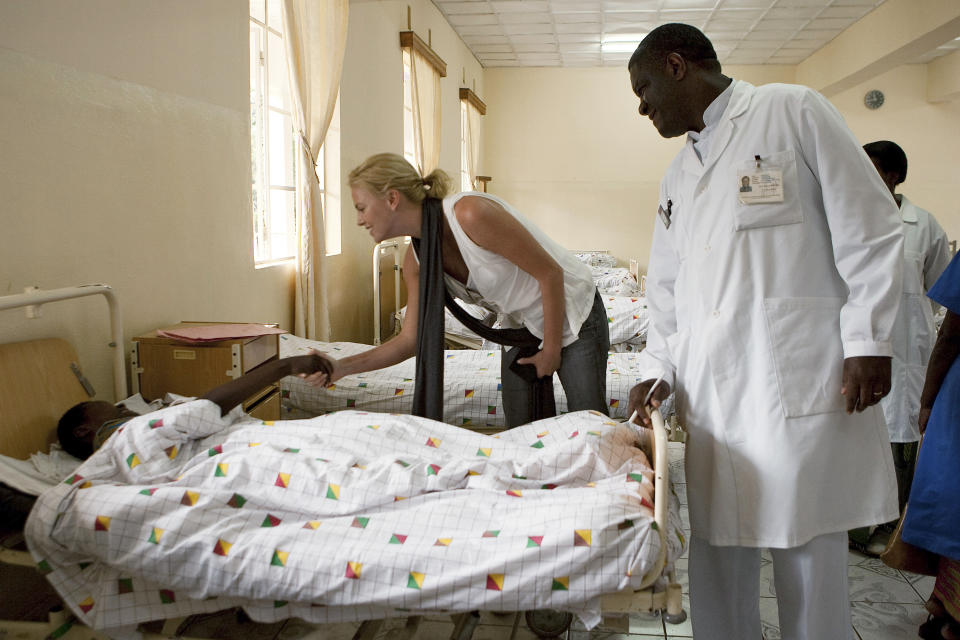 In this March 30, 2009, photo provided by the United Nations, Dr. Denis Mukwege, right, director of Panzi Hospital, stands by actress and U.N. Ambassador for Peace, Charlize Theron, as she visits the hospital in Bukavu, South Kivu, Congo. Mukwege, the Nobel Peace-prize winning surgeon whose hospital in war-torn Congo has treated over 50,000 victims of sexual violence, has launched a fund with the goal of providing reparations for survivors of conflicts around the world. (Marie Frechon/The United Nations via AP)