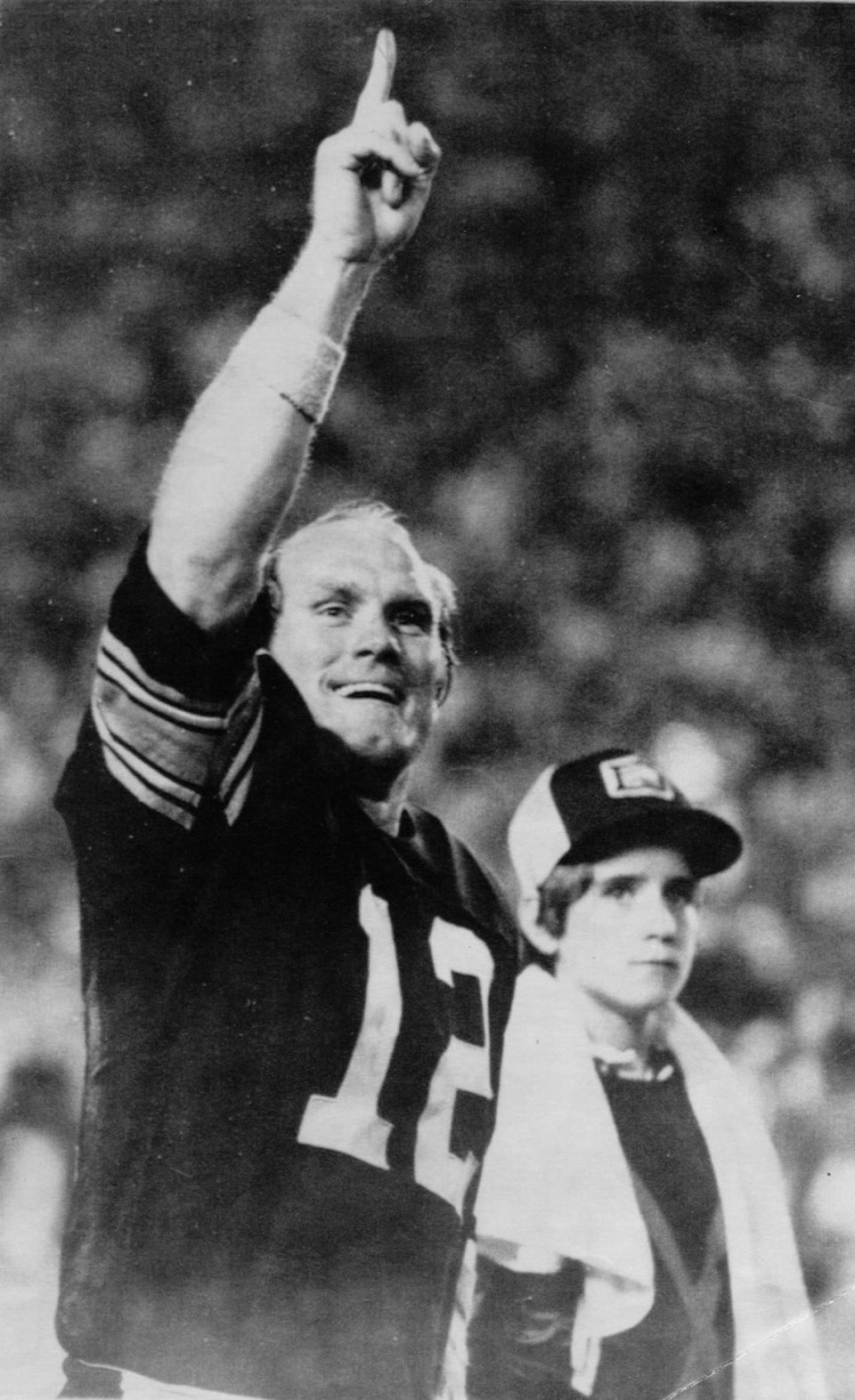 Pittsburgh Steelers quarterback Terry Bradshaw holds up one finger to indicate his team in No. 1 in the closing minutes of the Super Bowl against the Dallas Cowboys in Miami January 1979. File print scanned Sunday, January 24, 1999.