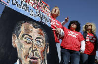 Supporters for the health care reform bill rally in front of the Supreme Court.