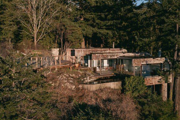 The home is located on its own private road and was designed by influential Vancouver architect Barry Downs to be in harmony with its natural surroundings.