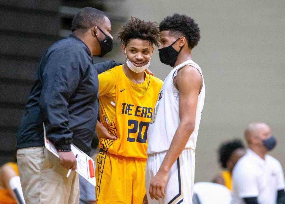 Southeast's Domnick Hobbs (20) tries to get in on the conversation between Sacred Heart-Griffin boys basketball head coach Tim Allen and Sacred Heart-Griffin's J'veon Bardwell (13) in the first half during the Boys CS8 Tournament at Jim Belz Gymnasium  in Springfield, Ill., Tuesday, March 9, 2021. [Justin L. Fowler/The State Journal-Register] 