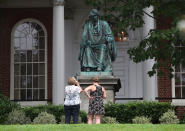 <p>Two women take pictures in front of the statue of US Supreme Court Chief Justice Roger Brooke Taney that sits in front of the Maryland State House, on August 16, 2017 in Annapolis, Md. Maryland Governor Larry Hogan has called for the removal of the statue. Taney was the author of the Dred Scott decision. (Photo: Mark Wilson/Getty Images) </p>