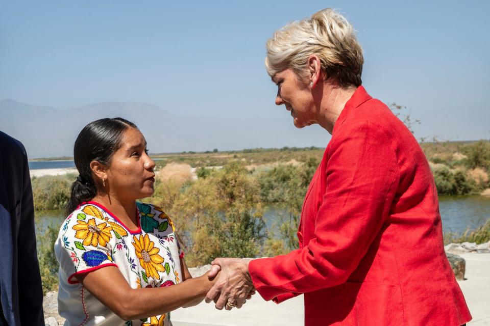 U.S. Secretary of Energy Jennifer M. Granholm, right, shares a moment with resident Maria Pozar outside the North Shore Beach and Yacht Club in Mecca, Calif., on April 20, 2022. Granholm and U.S. Rep. Raul Ruiz held a community listening session to hear from residents regarding the Salton Sea area. 