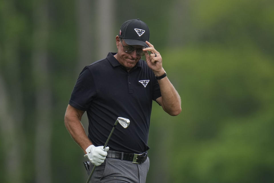 Phil Mickelson tip his cap on the 12th hole during the first round of the Masters golf tournament at Augusta National Golf Club on Thursday, April 6, 2023, in Augusta, Ga. (AP Photo/Jae C. Hong)