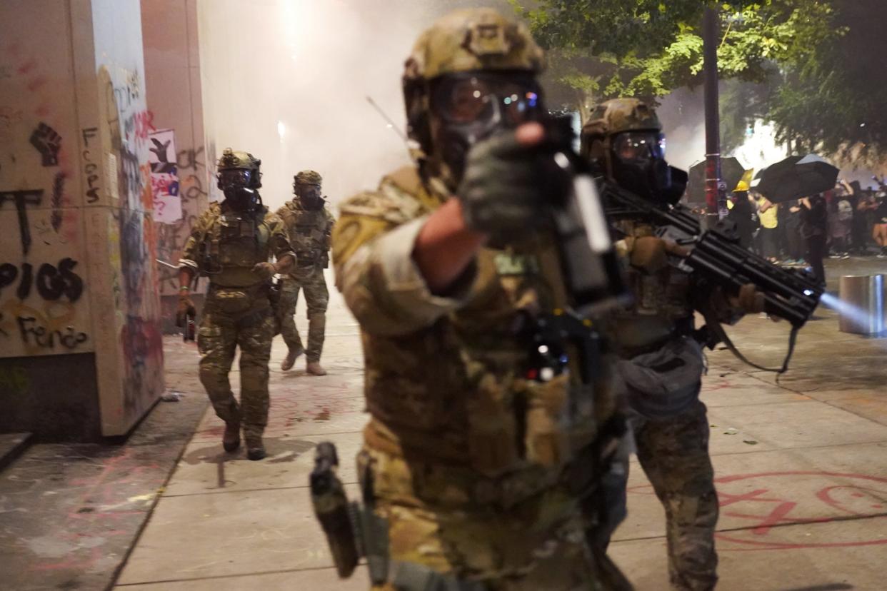 Federal police disperse a crowd of about a thousand protesters at the Mark O Hatfield courthouse in Portland on 20 July 2020: Getty