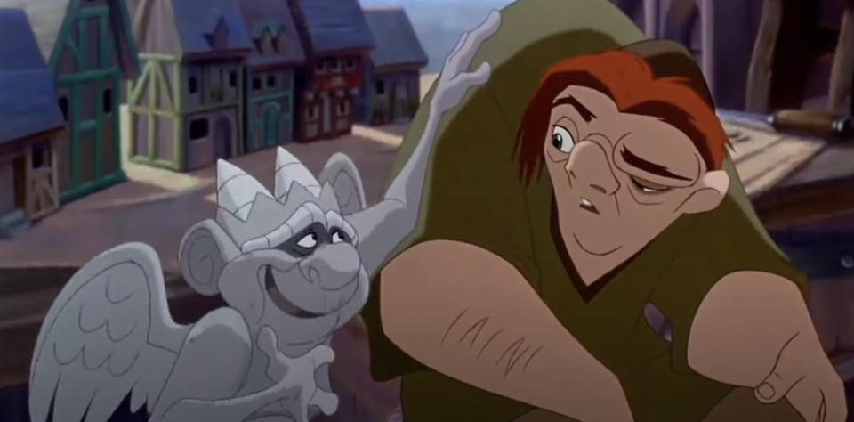 Animated characters Quasimodo and gargoyle Hugo from "The Hunchback of Notre Dame" in a scene together