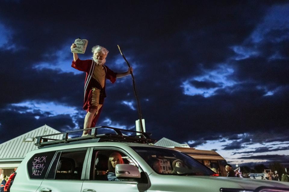 An anti-vaccine mandate protestor in costume arrives at Exhibition Park in Canberra on Feb. 12, 2022, in Canberra, Australia.