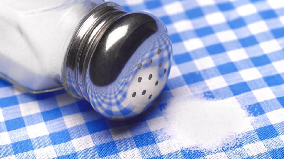 Close-up of a pile of salt on a tablecloth.
