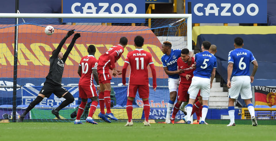 LIVERPOOL, ENGLAND - OCTOBER 17: (THE SUN OUT, THE SUN ON SUNDAY OUT ) Evertons Keane scores for Everton to make it 1-1 during the Premier League match between Everton and Liverpool at Goodison Park on October 17, 2020 in Liverpool, England. Sporting stadiums around the UK remain under strict restrictions due to the Coronavirus Pandemic as Government social distancing laws prohibit fans inside venues resulting in games being played behind closed doors. (Photo by John Powell/Liverpool FC via Getty Images)