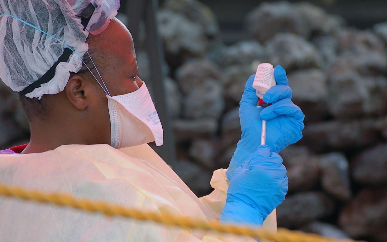 A nurse prepares a vaccine against Ebola in Goma, DRC - AFP