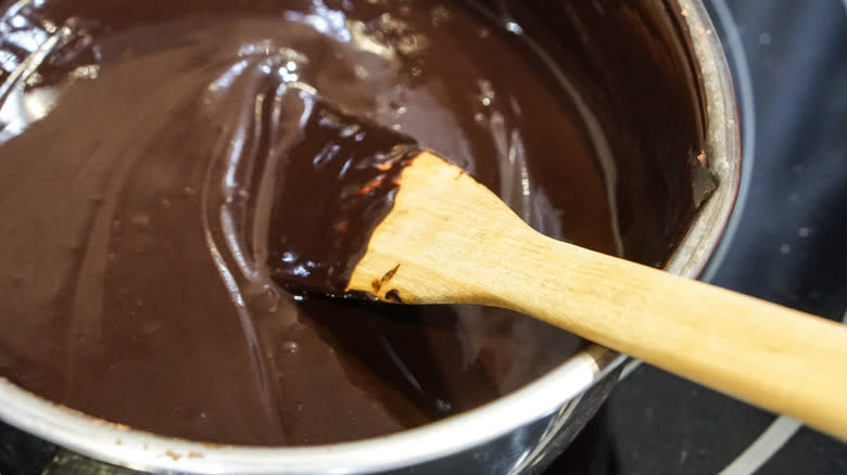 chocolate pudding stirred over stove