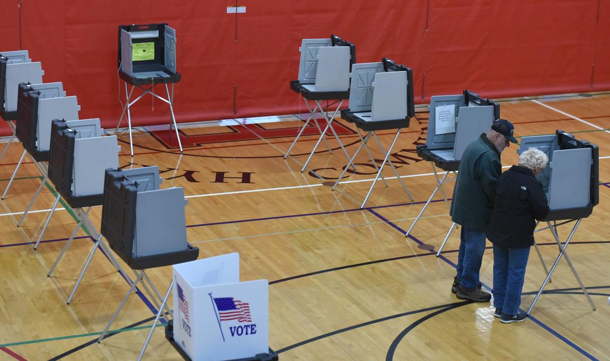 Mike Doumanian and his wife Jessie shared a booth as they had precinct 9 to themselves casting their ballots at the Hyannis Youth and Community Center on Election Day for the Town of Barnstable.