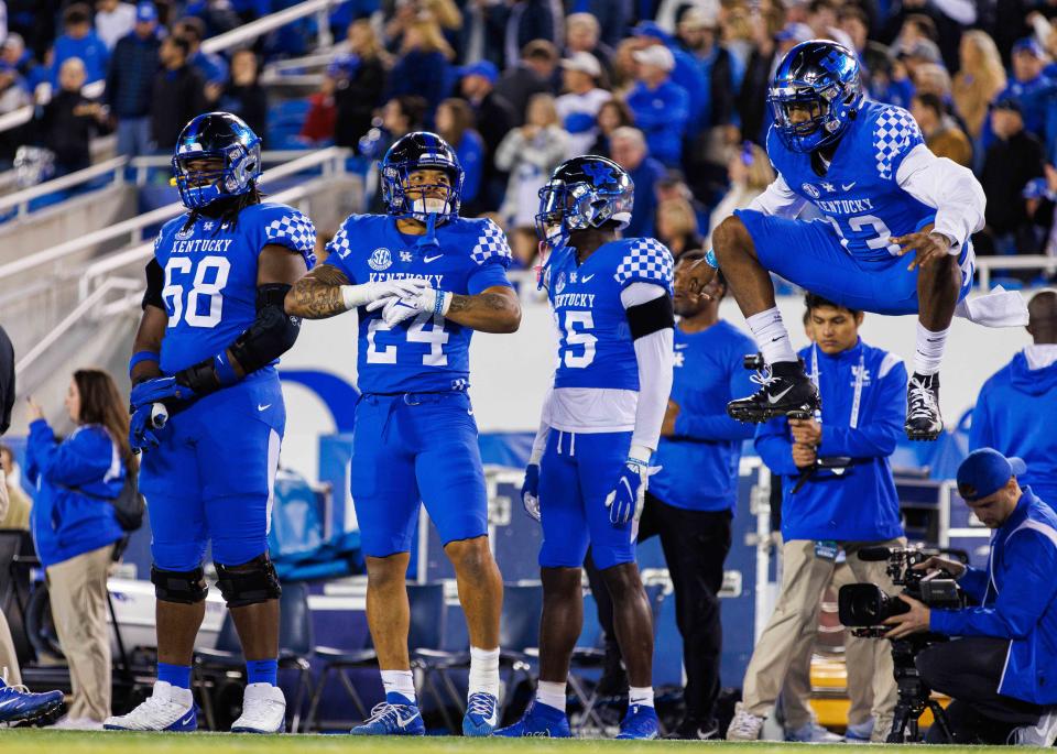 Oct 8, 2022; Lexington, Kentucky; Kentucky Wildcats offensive lineman Kenneth Horsey (68), running back Chris Rodriguez Jr. (24), linebacker Jordan Wright (15) and wide receiver Jordan Anthony (13) get ready for the coin toss before the game against the South Carolina Gamecocks at Kroger Field. Jordan Prather-USA TODAY Sports