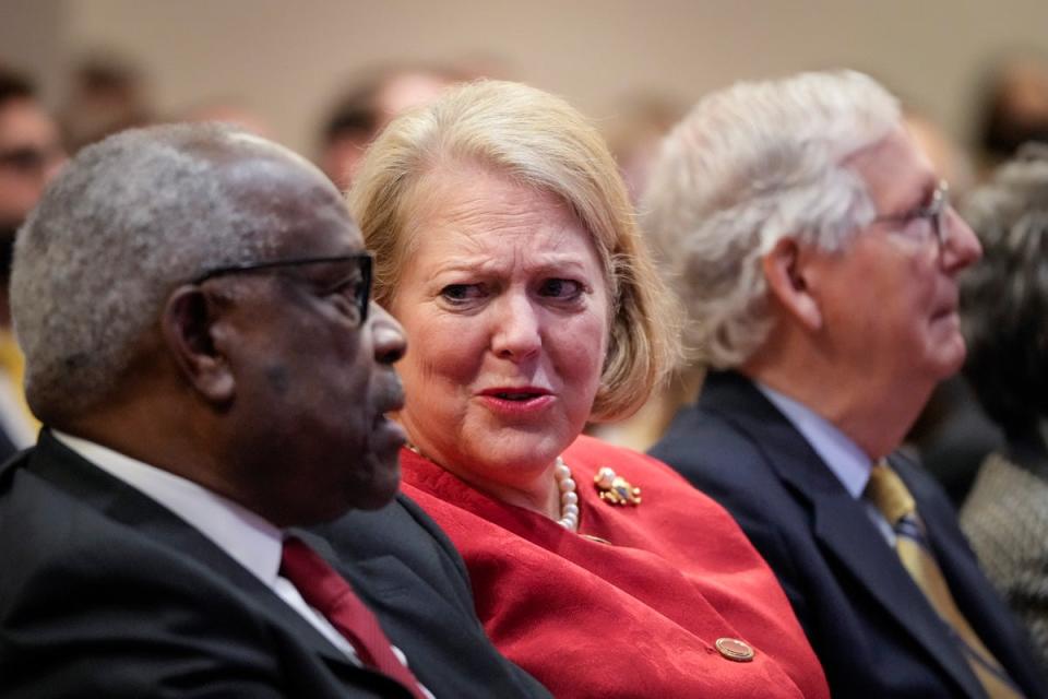 Clarence Thomas with his wife Ginni Thomas (centre) (Getty Images)