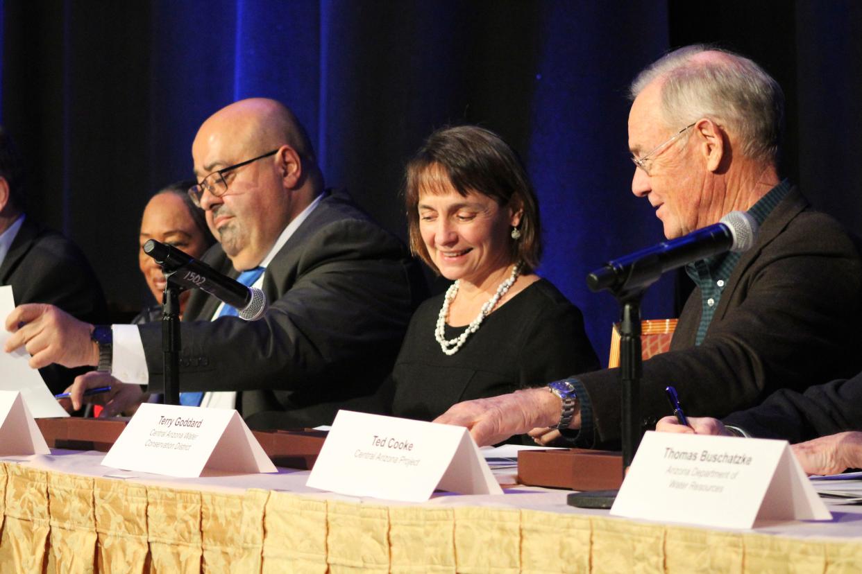 Water leaders for Arizona, Nevada, California and the Department of the Interior sign an agreement on Dec. 15, 2021, in Las Vegas to voluntarily reduce their take from the Colorado River to help stave off mandatory cuts in the upcoming years. Low water levels at Lake Mead triggered a federal shortage declaration and cutbacks as the region struggles to meet demands of all users.