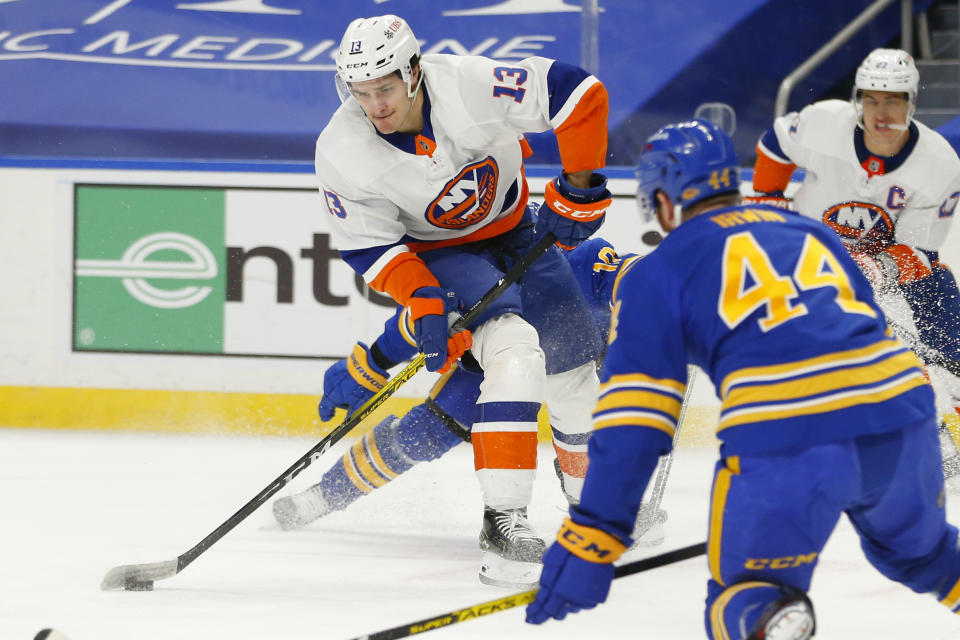 New York Islanders forward Josh Bailey (13) carries the puck during the first period of an NHL hockey game against the Buffalo Sabres, Tuesday, Feb. 16, 2021, in Buffalo, N.Y. (AP Photo/Jeffrey T. Barnes)