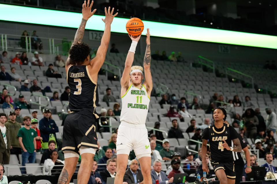 Mar 16, 2024; Fort Worth, TX, USA; South Florida Bulls forward Kasean Pryor (11) shoots against UAB Blazers forward Yaxel Lendeborg (3) during the first half at Dickies Arena. Mandatory Credit: Chris Jones-USA TODAY Sports