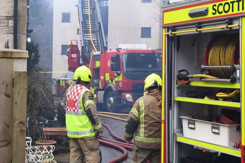 Smoke billows out from the fire ravaged roof as firefighters try to bring the fire under control -Credit:Stuart Vance/ReachPlc