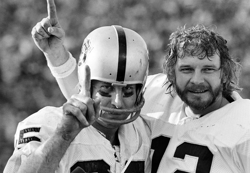 FILE - Oakland Raiders receiver Fred Biletnikoff, left, and quarterback Ken Stabler gesture after they defeated the Minnesota Vikings in NFL football's Super Bowl XI in Pasadena, Calif., Jan. 9, 1977.  Biletnikoff caught four passes for 79 yards to earn MVP honors. (AP Photo/File)