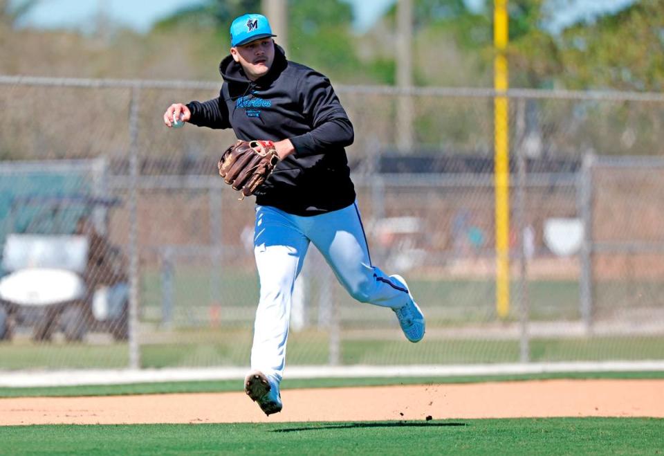 Miami Marlins third baseman Jake Burger looks to throw to first base during spring training at Roger Dean Chevrolet Stadium in Jupiter, Florida on Tuesday, February 20, 2024.