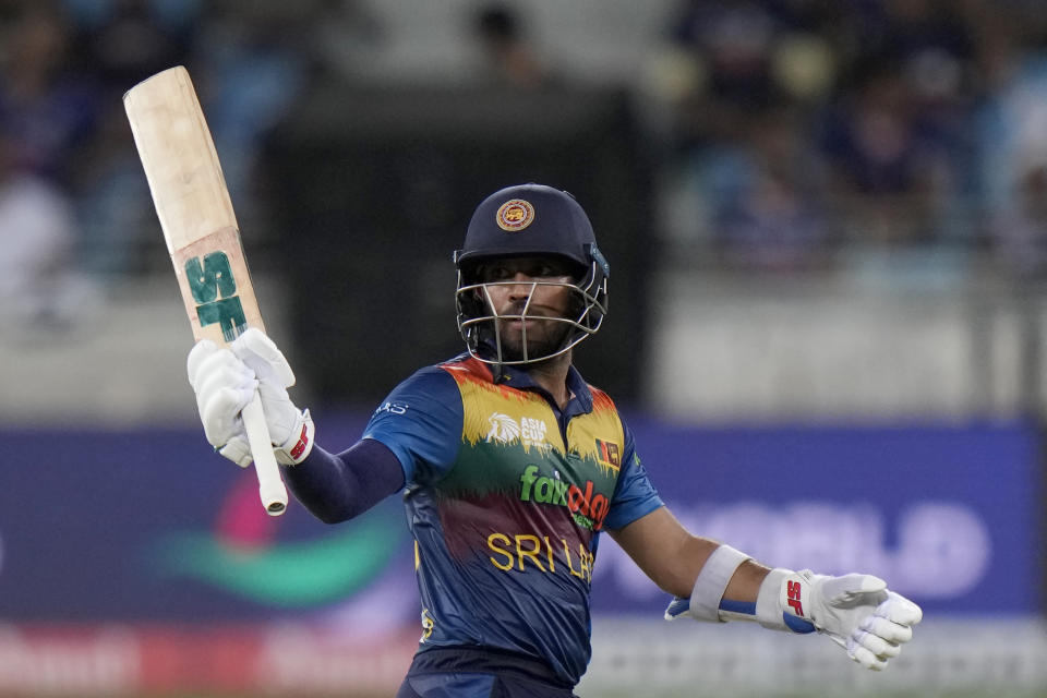 Sri Lanka's Kusal Mendis raises his bat to celebrate scoring fifty runs during the T20 cricket match of Asia Cup between Sri Lanka and India, in Dubai, United Arab Emirates, Tuesday, Sept. 6, 2022. (AP Photo/Anjum Naveed)