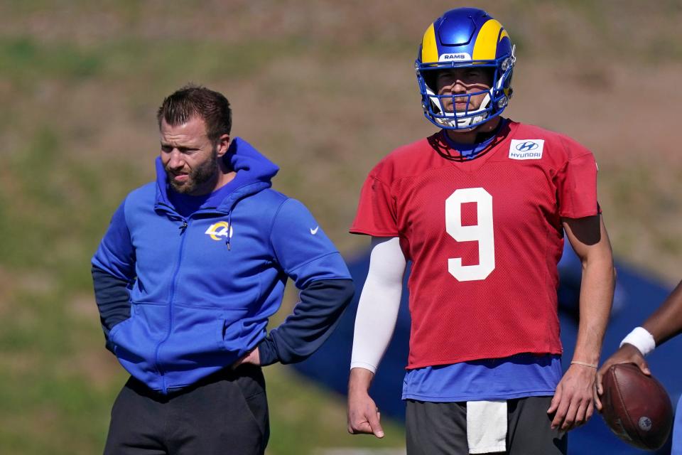 Head coach Sean McVay, left, stands on the field with Rams quarterback Matthew Stafford during practice Wednesday at Cal Lutheran University in Thousand Oaks.