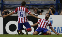 Atletico Madrid's Arda Turan (R) celebrates with teammate Koke a second goal against Zenit St. Petersburg during their Champions League Group G soccer match at Vicente Calderon stadium in Madrid September 18, 2013. REUTERS/Sergio Perez (SPAIN - Tags: SPORT SOCCER)