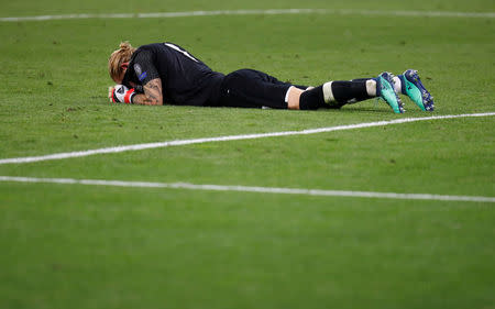 Liverpool's Loris Karius looks dejected after the match. REUTERS/Kai Pfaffenbach