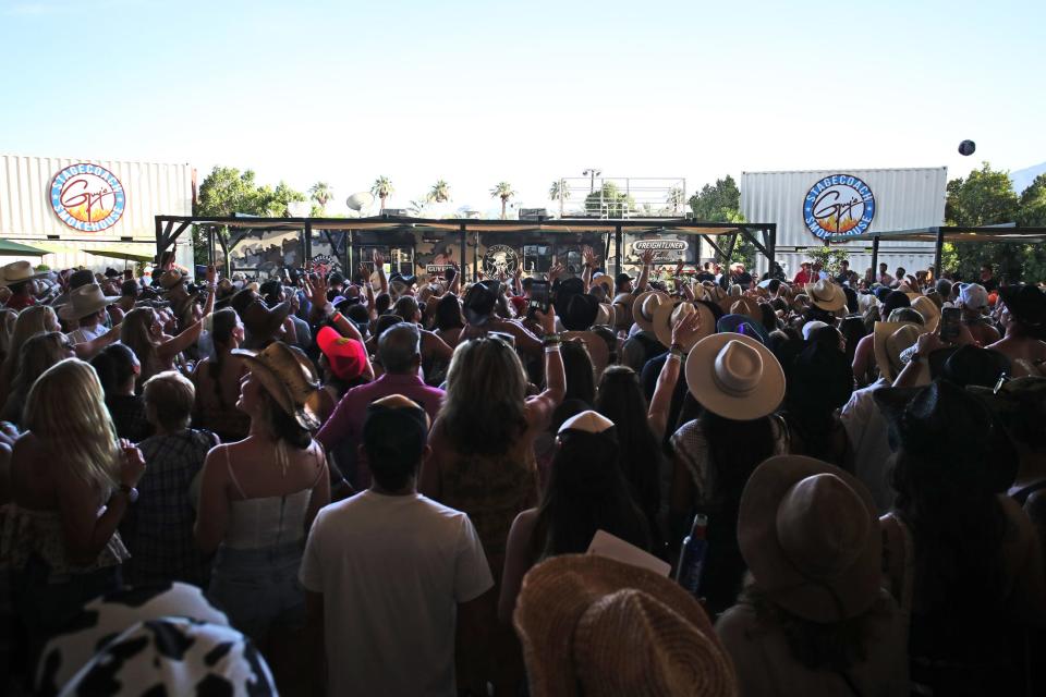 People pack the Stagecoach Smokehouse to see Old Dominion and Guy Fieri do a cooking demo during Stagecoach country music festival at the Empire Polo Club in Indio, Calif., on Saturday, April 29, 2023.