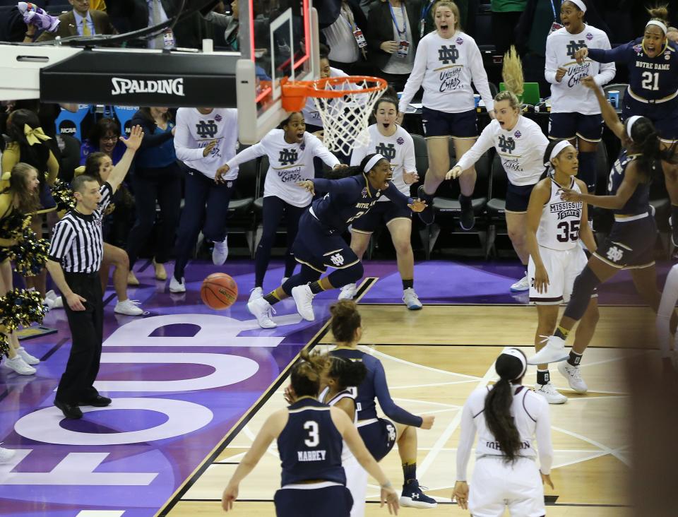 Official Joe Vaszily, far left, signals as Notre Dame's game-winning shot falls through the basket in the 2018 NCAA Tournament final.