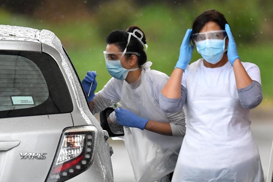 Coronavirus testing staff (AFP via Getty Images)