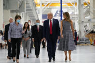 President Donald Trump and first lady Melania Trump listen as Marillyn Hewson, chief executive officer of Lockheed Martin, second from left speaks during a tour of NASA facilities before viewing the SpaceX Demonstration Mission 2 Launch at Kennedy Space Center, Wednesday, May 27, 2020, in Cape Canaveral, Fla. From left, Vice President Mike Pence, Hewson, second lady Karen Pence, Kennedy Space Center director Bob Cabana, Donald Trump and Melania Trump. (AP Photo/Evan Vucci)