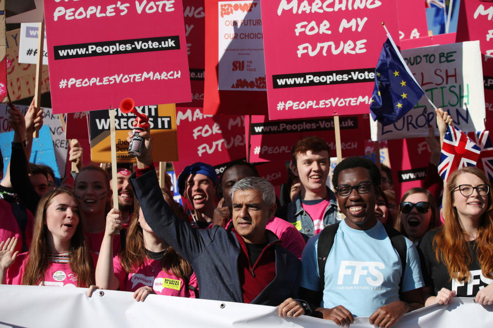 Mayor of London Sadiq Khan, front centre, holds a klaxon horn, as he joins protesters in the People's Vote March for the Future, in London, Saturday Oct. 20, 2018. Some thousands of protesters are marching through central London, Saturday, to demand a new referendum on Britain’s Brexit departure from the European Union. (Yui Mok/PA via AP)