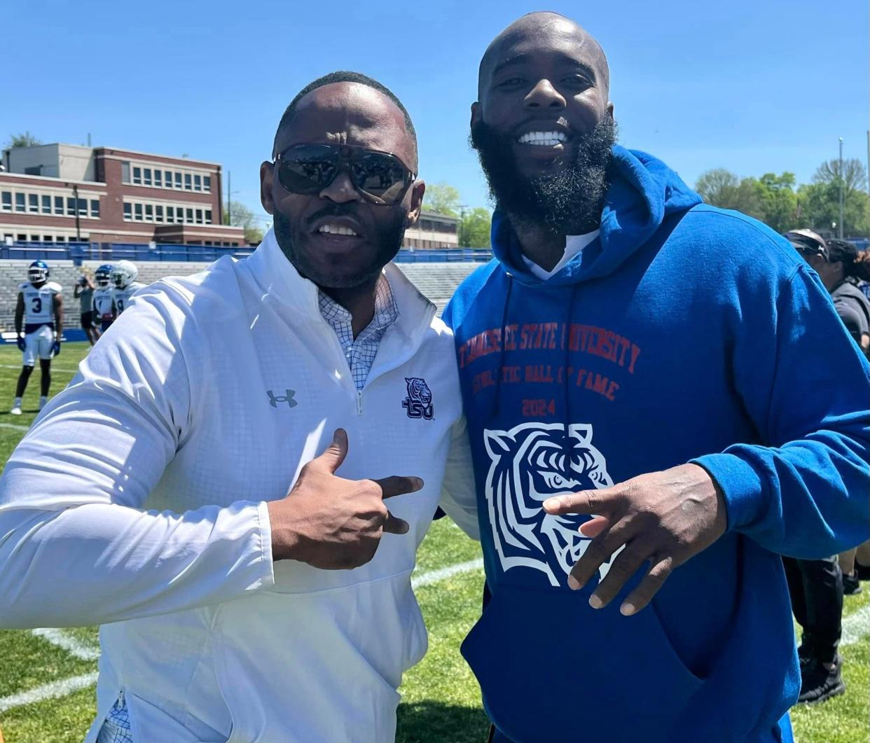 Former Tennessee State defensive back Dominique Rogers-Cromartie, right, shown here at the Tigers spring football game with athletic director Mikki Allen, was inducted into the school's Athletic Hall of Fame Sunday.