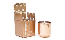 A perfect gift for your hostess, Jonathan Adlers Champagne scented candle smells like violet leaves, sparkling Champagne, and rose petals. Bonus: it comes in a pretty, reusable, rose gold vessel.To buy: amazon.com, $38