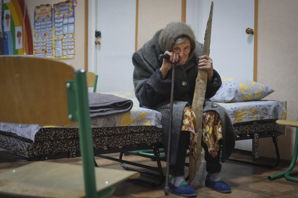 In this photo provided by the Ukrainian National Police of Donetsk region, 98-year-old Lidia Lomikovska sits in a shelter after she escaped Russian-occupied territory in the Donetsk region, Ukraine, Apil. 26, 2024. Lomikovska left the frontline town of Ocheretyne last week by walking almost 10 km (6 miles) alone, after Russian troops entered it and fighting intensified. (Ukrainian National Police of Donetsk region via AP)